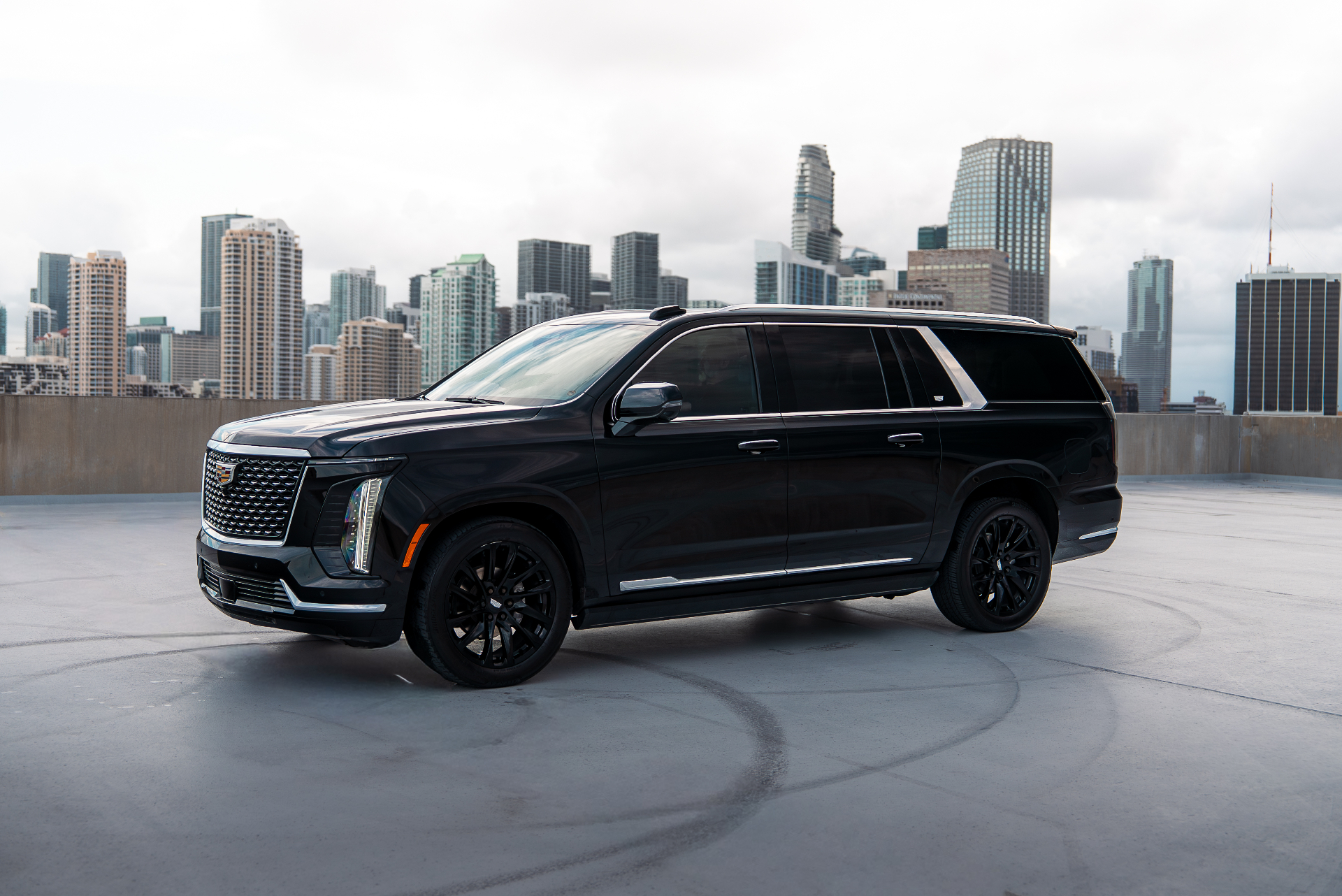 Cadillac Escalade ESV against a city skyline